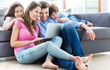Family using laptop at home